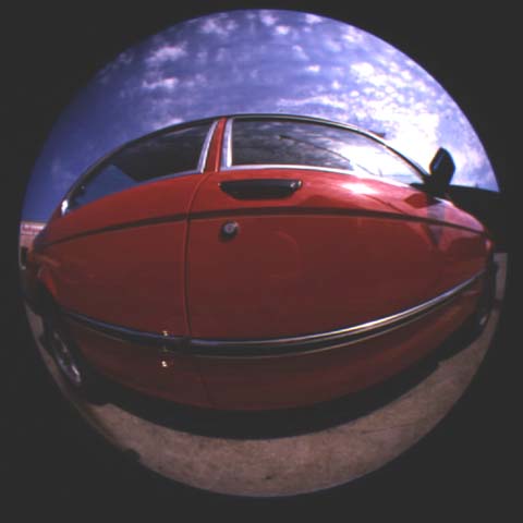 circular fisheye photo of distorted car
in square 
box