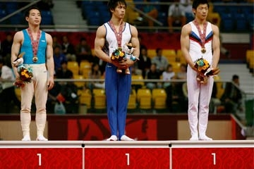 Jo Jong Chol, Hiroyuki Tomita, Kim Soo Myun all stand proudly atop the podium © Getty Images