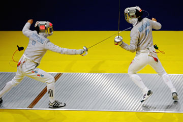Men's team sabre in fencing action © Getty Images