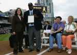 Caridad Sanchez, Field Representative for Senator Barbara Boxer, presents the Congressional Record Statement to Padres? legend, Tony Gwynn, congratulating him on his induction into the National Baseball Hall of Fame on July 2007.