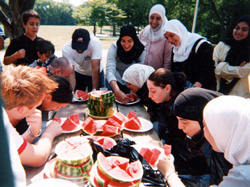 Interfaith Youth Forum picnic watermelon-eating contest