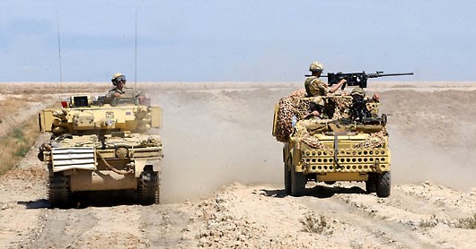 'D' Squadron, the Household Cavalry Regiment, in their Scimitar Armoured Reconnaisance Vehicle (left), hand over their area of resposiblity to the 1st Battalion, the Parachute Regiment, in their WMIC (Weapon Mounting Infantry Carrying) Vehicle, near Basra. 