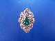 An 18ct white gold emerald and diamond cluster dress ring