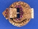 An antique 14ct gold amethyst set buckle brooch