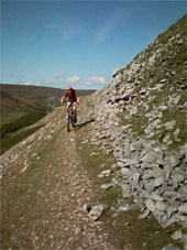 A cyclist negotiating a path on the Yorkshire Dales