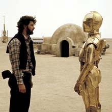 A younger Lucas directs Anthony Daniels, who played C-3PO, while making the original 'Star Wars.' (AP Photo)