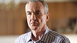 Larry Lamb as Archie Mitchell