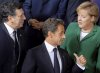 De izq a der) El presidente de la Comisión Europea, José Manuel Durao Barroso; el presidente francés, Nicolás Sarkozy, y la canciller alemana, Ángela Merkel.